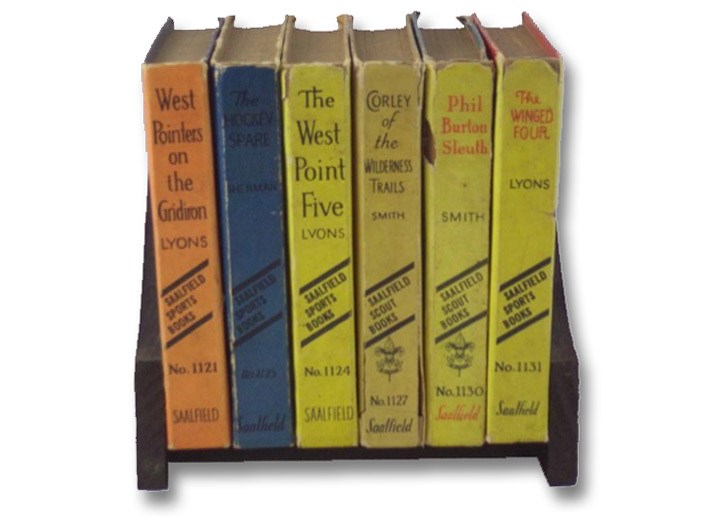 Six Volume Saalfield Boys' Adventure and Sports Series Set with Book Stand: West Pointers on the Gridiron; The West Point Five; The Hockey Spare; Corley of the Wilderness Trails; Phil Burton Sleuth; The Winged Four (Saalfield 1121, 1124, 1125, 1127, 1130, 1131), Lyons, Kennedy; Smith, Leonard K.; Sherman, Harold M. Six Volume Saalfield Boys' Adventure and Sports Series Set with Book Stand: West Pointers on the Gridiron; The West Point Five; The Hockey Spare; Corley of the Wilderness Trails; Phil Burton Sleuth; The Winged Four (Saalfield 1121, 1124, 1125, 1127, 1130, 1131), Lyons, Kennedy; Smith, Leonard K.; Sherman, Harold M.